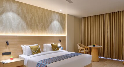 Palette Hotel & Convention Centre by CheckIn, Millennium City Gurugram Room Type - Deluxe King Room with Balcony