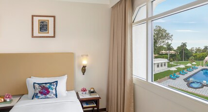 Tajview, Agra - IHCL SeleQtions Room Type - Deluxe Room Pool View Twin Bed with Shower Cubical Tajview, Agra - IHCL SeleQtions Room Type - Deluxe Room Pool View Twin Bed with Shower Cubical