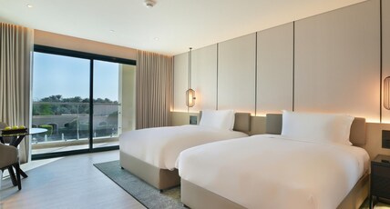 Al Ain Rotana Room Type - Pool View Room with Balcony - Twin Beds Al Ain Rotana Room Type - Pool View Room with Balcony - Twin Beds
