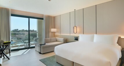Al Ain Rotana Room Type - Pool View Room with Balcony - King Bed
