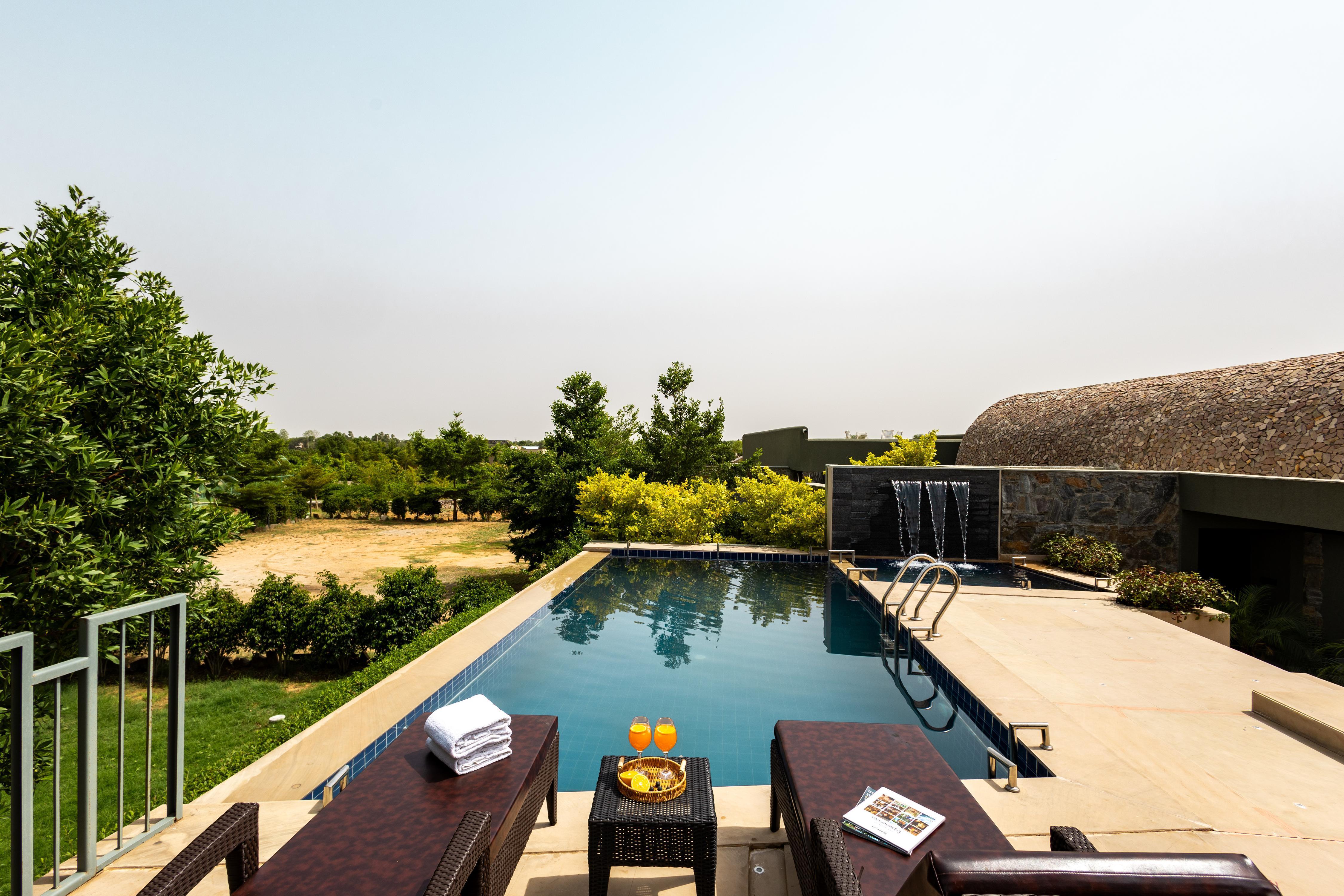 ELIVAAS Signature Earthstone 4 BHK Pvt Pool Villa - Tap to explore photos